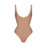 SKIMS BODY UNLINED PLUNGE THONG BODYSUIT | SIENNA