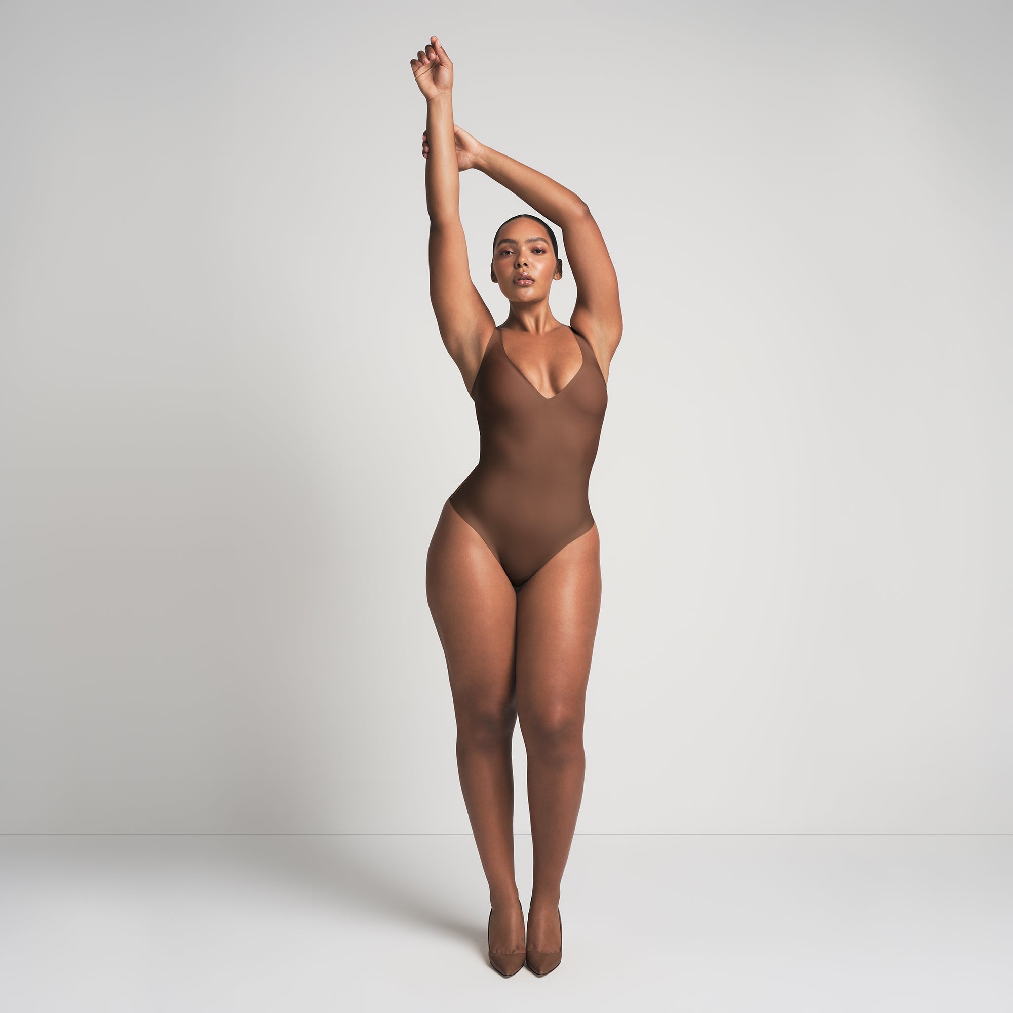 SKIMS BODY UNLINED PLUNGE THONG BODYSUIT | JASPER