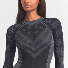 SKIMS FIRST LAYERS HALF ZIP ONESIE | OBSIDIAN WINTER FAIRISLE